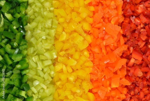 Multicolored stripes of five varieties sweet peppers, collected in gradient rainbow background