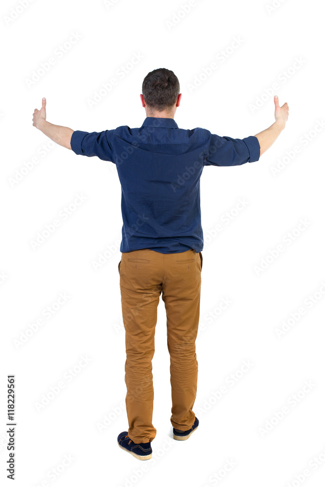 Back view of  business man shows thumbs up.   Rear view people collection. cheerful office worker shows positive emotions.  backside view of person.  Isolated over white background. a man in a blue