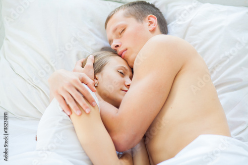 Lifestyle. Beautiful couple in bed