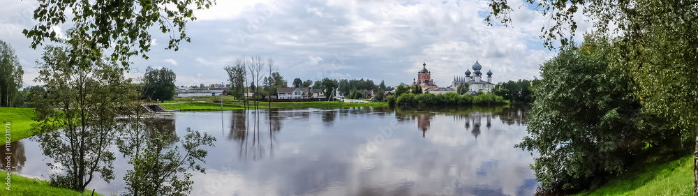 Panorama Tikhvin assumption male monastery, it is the Tikhvin icon of the mother of God. The Orthodox Church of Russia. The temple on the banks of the Tikhvinka river in Tikhvin.