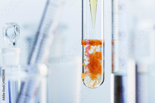 Chemical reaction-Pipette 0.25 M solution of iron(III) chloride (FeCl3) into 0.5 M solution of sodium carbonate (Na2CO3). Rusty red iron(III) hydroxide precipitate (Fe(OH)3) & carbon dioxide produced photo