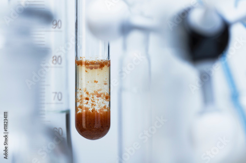 Chemical reaction-Rusty red iron(III) hydroxide precipitate (Fe(OH)3) in test tube formed reaction between iron(III) chloride (FeCl3) & sodium carbonate (Na2CO3): FeCl3+Na2CO3+H2O ->Fe(OH)3+NaCl+CO2