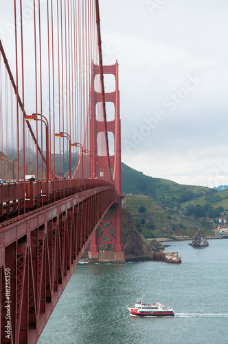 San Francisco, California, USA - APRIL 22, 2016:  Ferry ship under Golden Gate Bridge, documentary editorial.