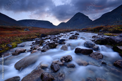 Silhouetted mountains and Malaya Belaya river, Khibiny mountains, Kola Peninsula, Russia