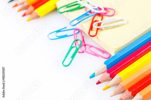 set of colored pencils and paper clips