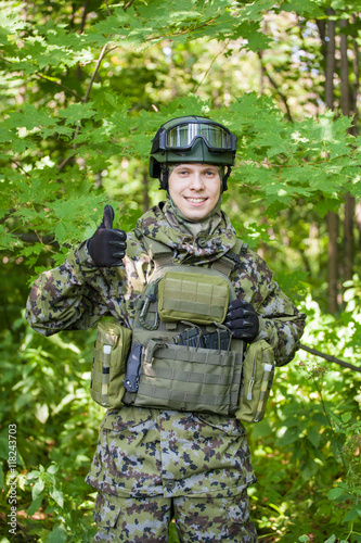 Forces soldiers in the woods with a Kalashnikov