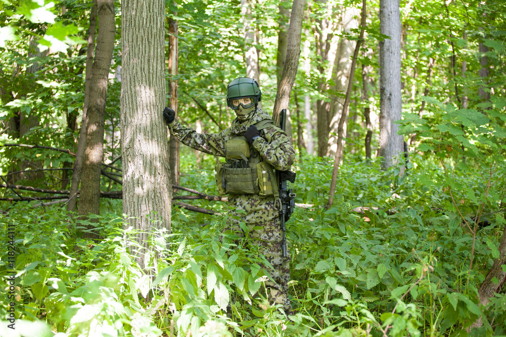 Forces soldiers in the woods with a Kalashnikov