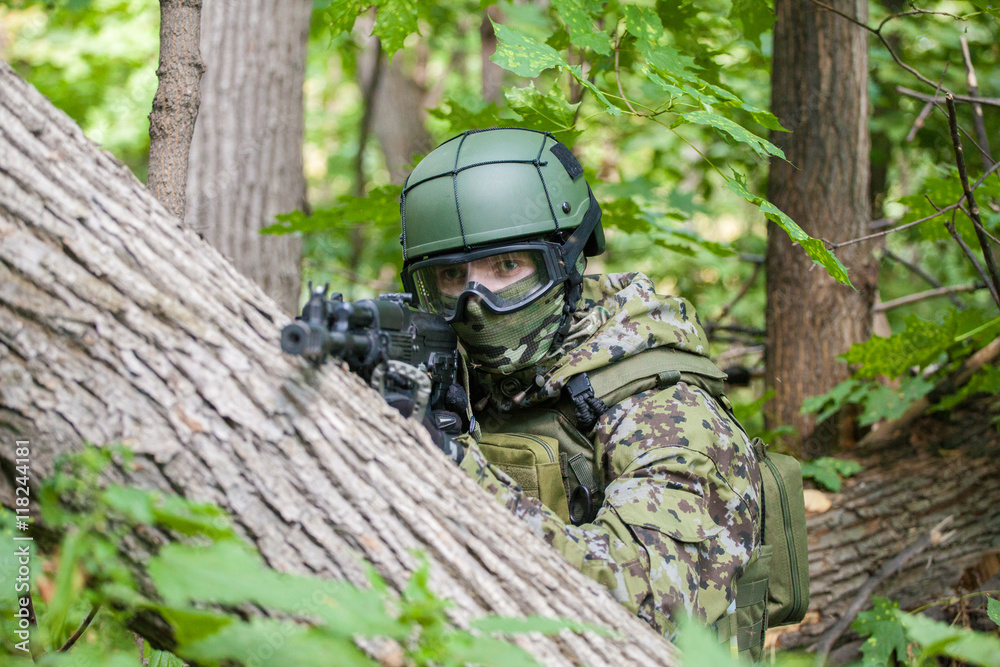 Forces soldiers in the woods with a Kalashnikov Forces soldiers in the woods with a Kalashnikov