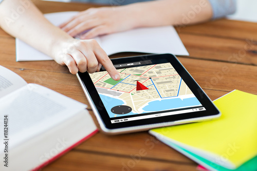 close up of student with tablet pc and notebook