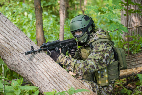 Forces soldiers in the woods with a Kalashnikov