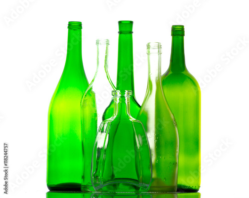 colored empty glass bottles for wine isolated on white background