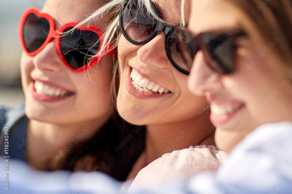 group of smiling women taking selfie on beach group of smiling women taking selfie on beach