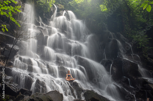 serenity and yoga practicing at waterfall Kanto Lampo, Bali,Indonesia