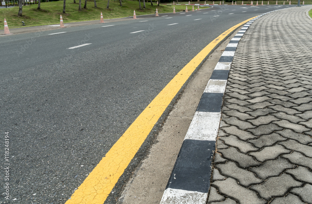 Asphalt road with yellow line