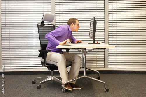 Near-sightedness,  myopia. Office worker at work station