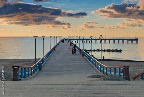 Colorful sunset at a famous marine pier in resort city of Palanga, Lithuania,...