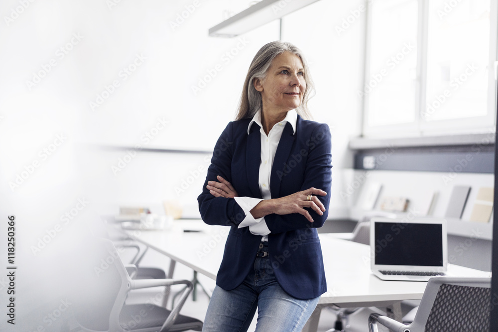 Senior businesswoman in conference room Senior businesswoman in conference room