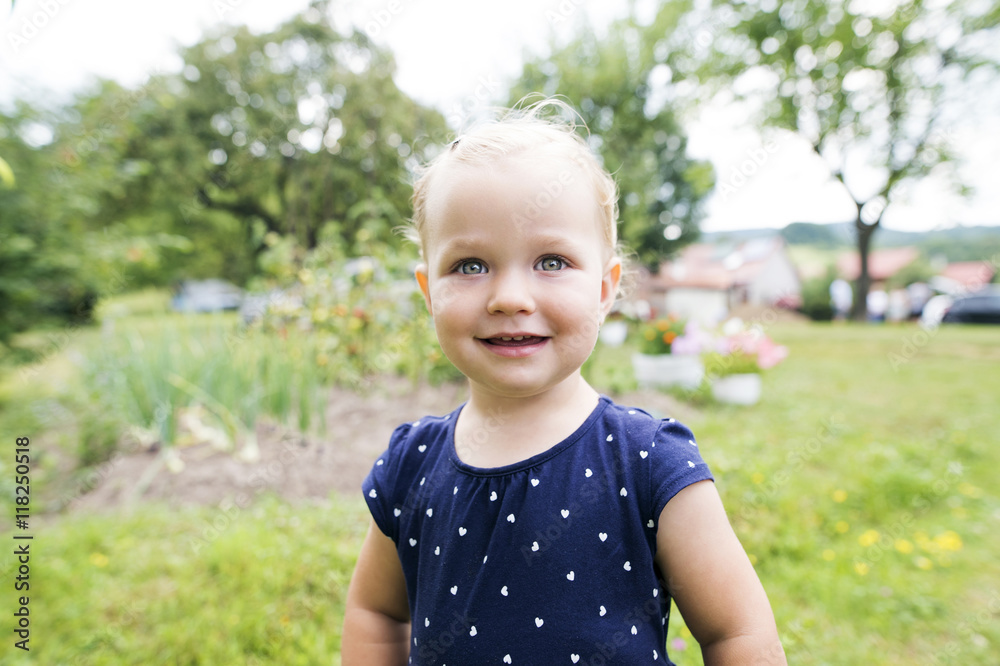 Portrait of little blond girl in the garden Portrait of little blond girl in the garden