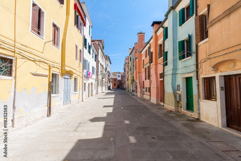 Street feature with multicolored houses in Chioggia, the little