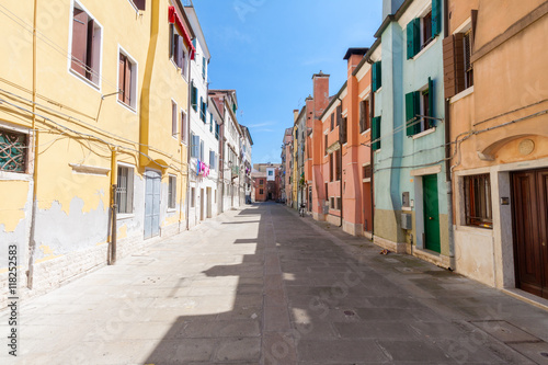 Street feature with multicolored houses in Chioggia, the little © cividin