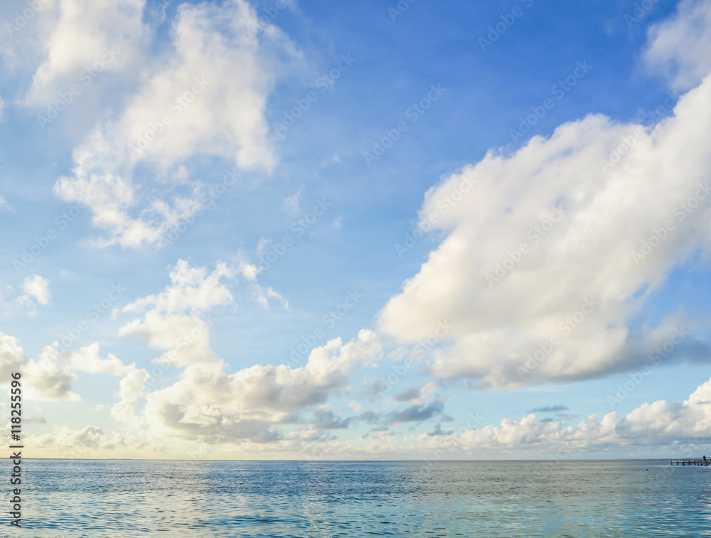 Clear blue sea, sky and white clouds Clear blue sea, sky and white clouds