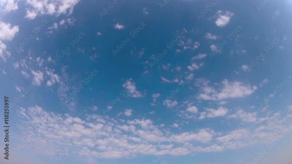 Time lapse clip of white fluffy clouds over blue Time lapse clip of white fluffy clouds over blue