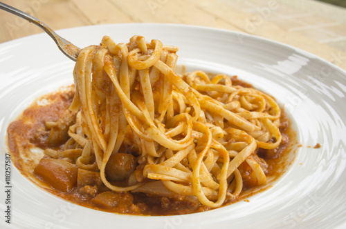 fresh homecook spaghett on wooden table