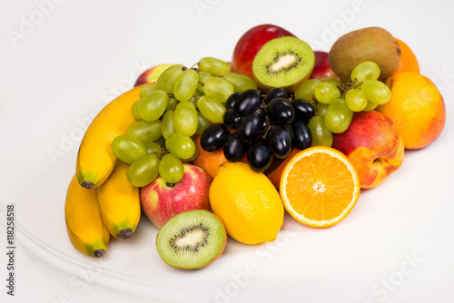 A plate of fresh fruit closeup. Healthy eating  diet and vitamins