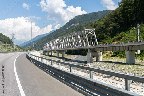 highway and railway bridge over Mzymta River in the mountains