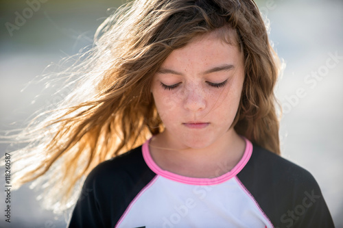 Portrait of young girl, sad expression photo