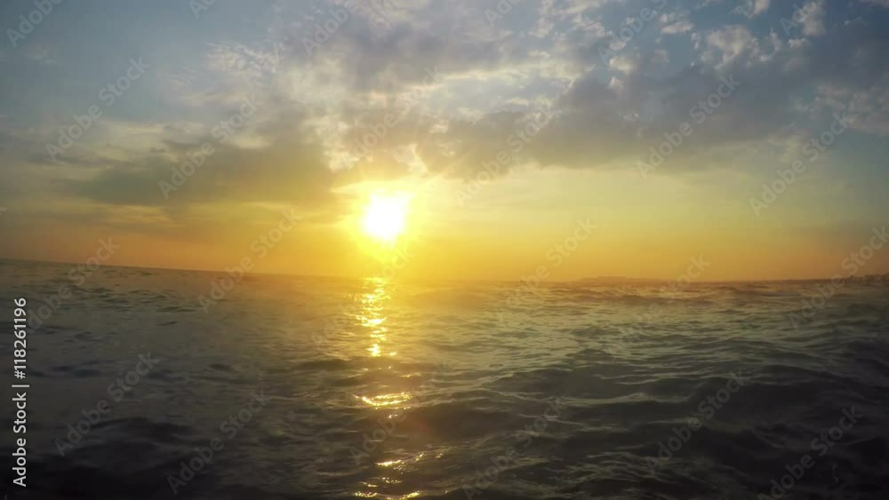 Sunset on the beach - Tranquil idyllic scene of a golden sunset over the sea