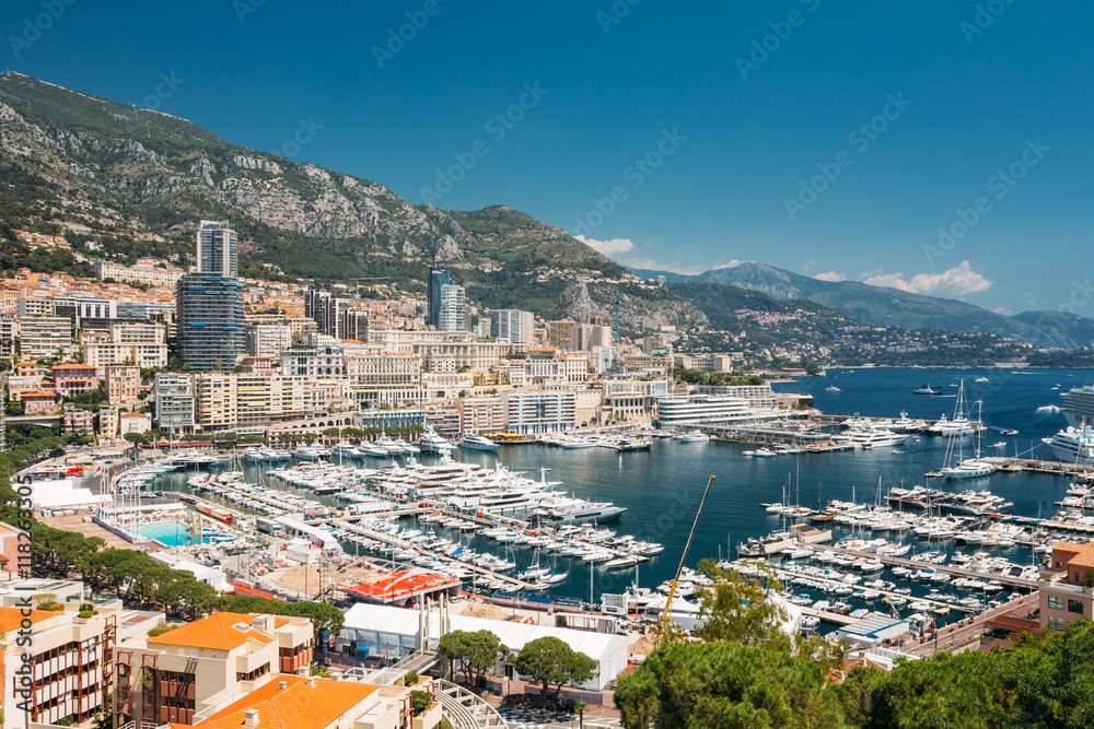 Monaco, Monte Carlo Cityscape. Architecture On Mountain Hill Background