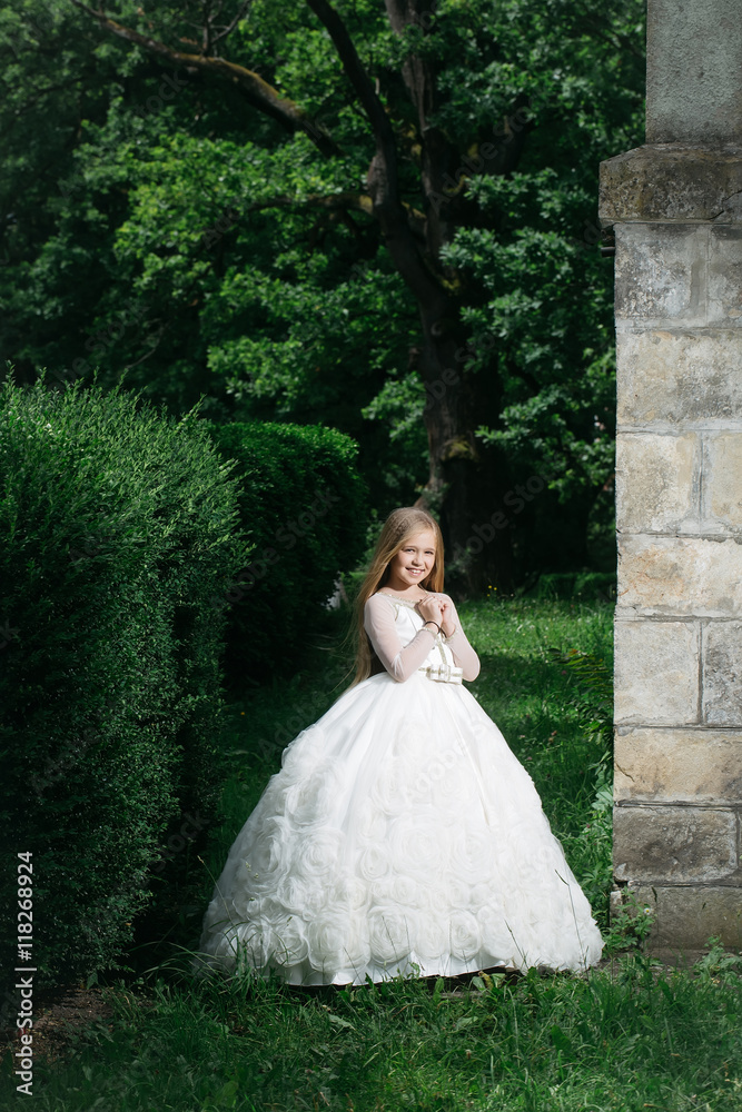 small girl in white dress outdoor