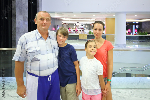 A woman and elderly man with boy and girl (with model release) in the vestibule of the Hotel Radisson Blu Paradise Resort and Spa