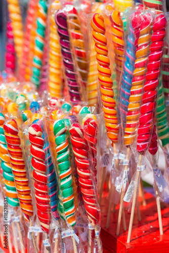 Colorful handmade swirl lollipops on street market