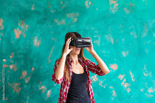 Woman wearing virtual reality goggles © satura_