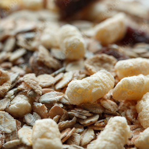 Healthy breakfast from a dry muesli, raisins and oat flakes. Food made of granola and muesli.