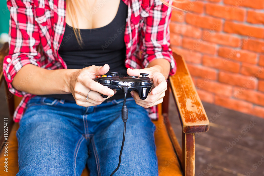 Naklejka premium technology, virtual reality, entertainment and people concept - woman with vr headset playing game.