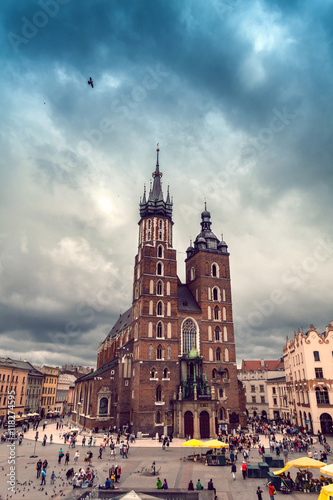 Church of St. Mary in the main Market Square in cloudy weather. Basilica Mariacka. Dramatic sky. Krakow. Poland.