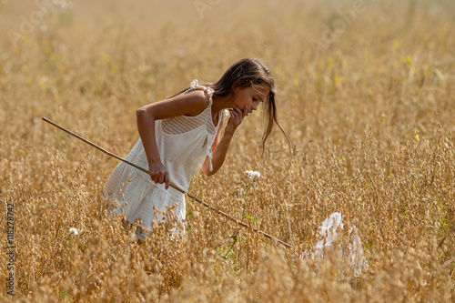 girl with butterfly net and a white dress