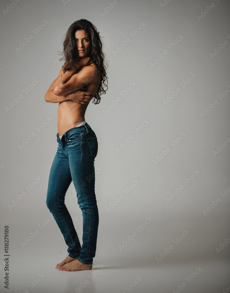 Barefoot woman in jeans and bare chest Stock Photo | Adobe Stock