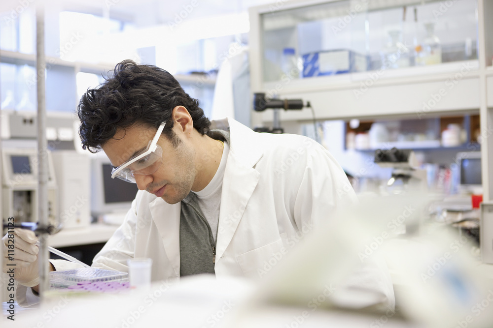 Middle Eastern scientist working in laboratory Middle Eastern scientist working in laboratory