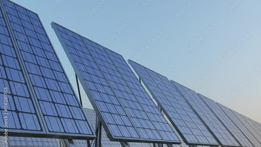 Row of modern solar panels against blue sky. Renewable solar energy generation. 4K seamless loopable clip. ProRes Row of modern solar panels against blue sky. Renewable solar energy generation. 4K seamless loopable clip. ProRes