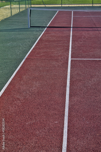 Tennis field with red and white lines © manuels1973