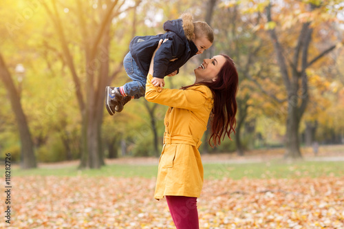 Mother and son playing in the autumn park © didesign