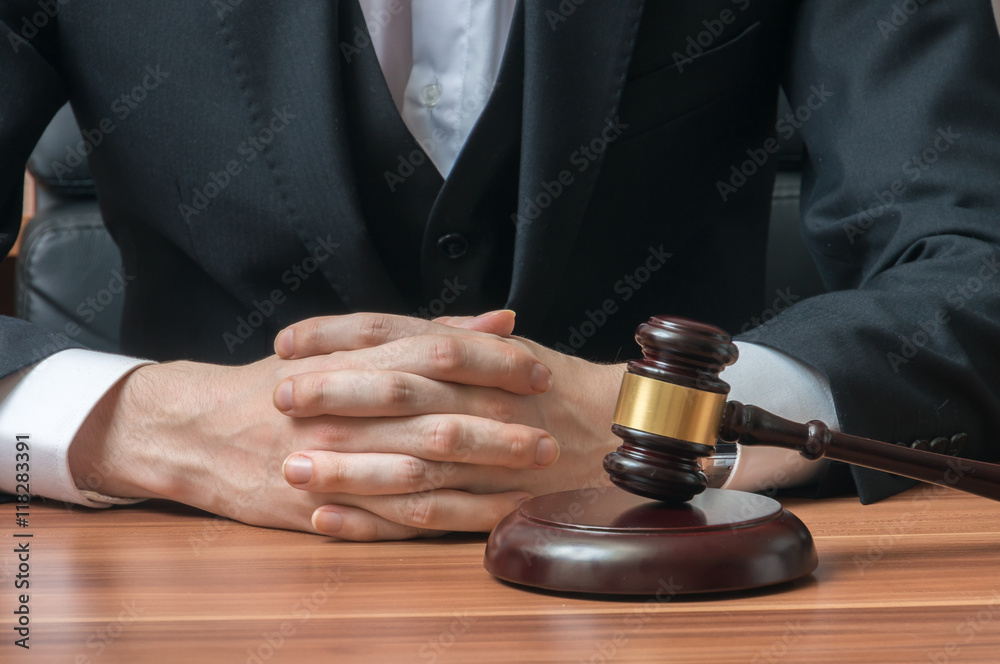 Law and justice concept. Judge or magistrate has clapsed hands. Law and justice concept. Judge or magistrate has clapsed hands.