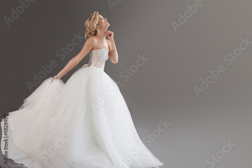 Print op canvas Charming young bride in luxurious wedding dress