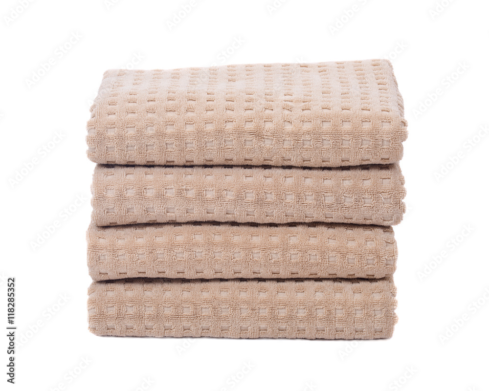 Organic cotton folded bath towels separated on white background