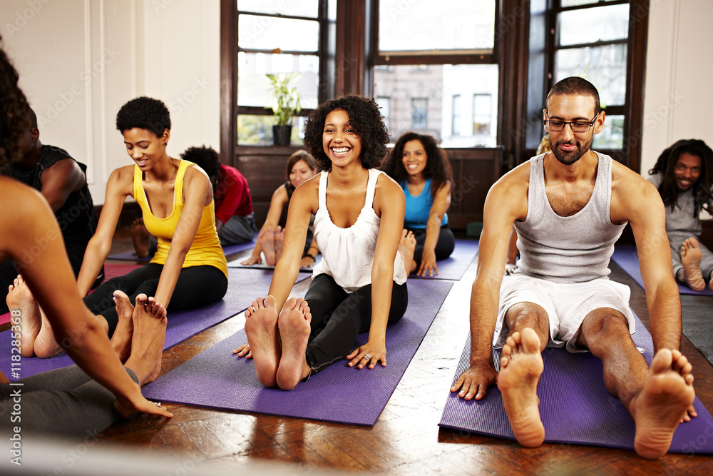 People practicing yoga in class People practicing yoga in class