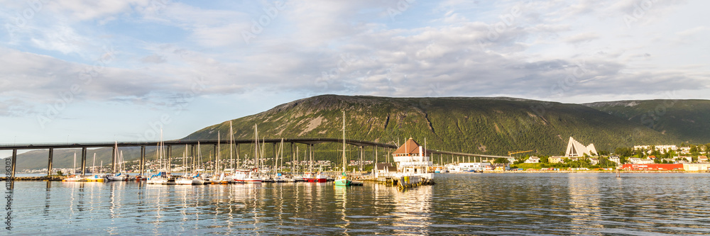 Skyline with the harbor, bridge and arctic cathedral of Tromso i